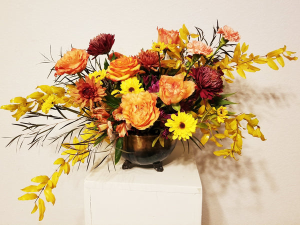  elegant centerpiece features roses, seasonal fall flowers, fillers, and greenery, perfect for your Thanksgiving table 